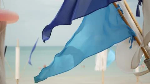 Blue flags waving in wind. Small triangular blue flags fluttering in wind in  Stock Photos