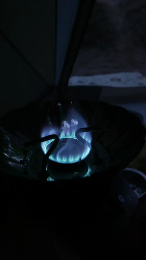 Blue Flame Burning Brightly on Portable Camping Gas Stove at Night Stock Footage 341996900