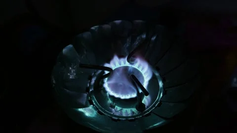 Blue Flame Burning on Portable Camping Stove During Nighttime Cooking Stock Footage 341994841