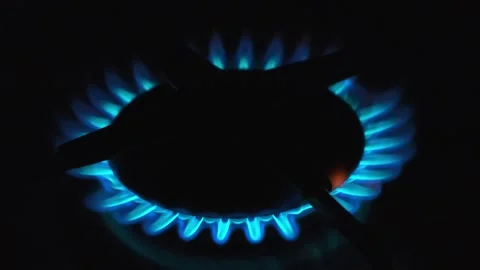 The blue flame of the gas burner on the kitchen stove Stock Footage 227048795
