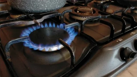 Blue flame of methane on the kitchen's stove. methane gas of the stove. Video stock 225531233