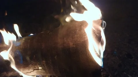 Blue Flames and Thin Smoke: A Close-up of Burning Wood Stock Footage 239921309
