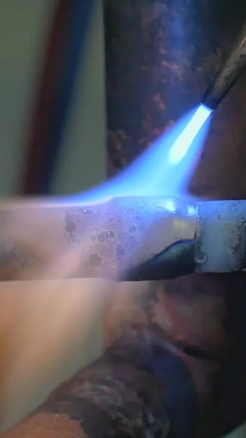 Blue Flame's Dance on Industrial Pipework Creation Stock Footage 344607874