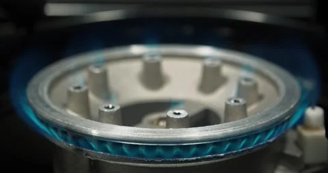 Blue flames of gas burning from kitchen gas stove. Gas burner with burning fire Stock Footage 316501495