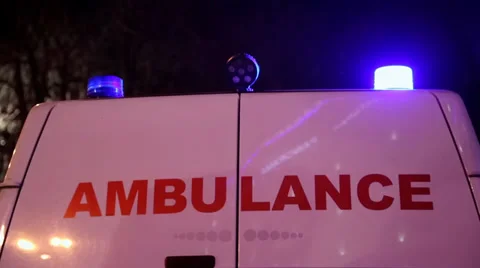 Blue flashing emergency lights on ambulance car Stock Footage
