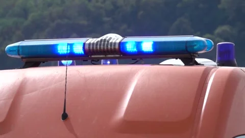 Blue flashing warning light, emergency services. Close up flash on ambulance Stock Footage 296727057