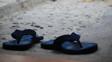Blue Flip-Flops on Concrete Surface Stock Photos