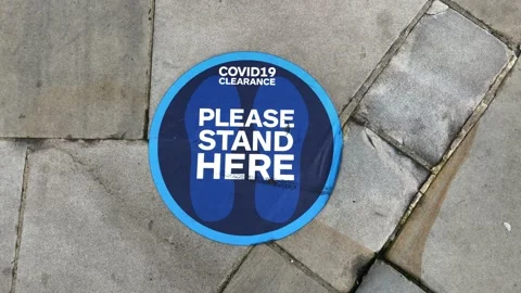A blue floor pavement social distancing sticker label. Stock Footage 142326387