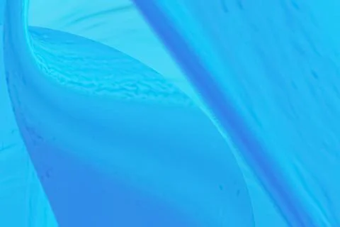 Blue flowing liquid waves abstract motion blurred background. Stock Illustration