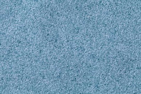 Blue fluffy background of soft, fleecy cloth. Texture of denim wool textile. Stock Photos