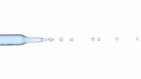 Blue fluid flows from graduated lab dropper Stock Footage 167163509