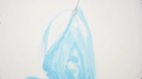 Blue fluid with tiny grey bubbles is injected into white one 库存影片 154382021