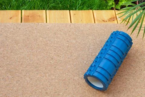 Blue Foam Roller on Cork Surface Outdoors Stock Photos