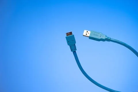 Blue folded HDMI cable studio shot isolated on blue background Фото