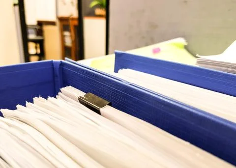 Blue folder document with Paper sheet on office and finance background Foto stock