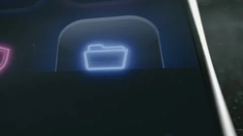Blue folder icon illuminates on a smartphone interface Stock Footage 342487751