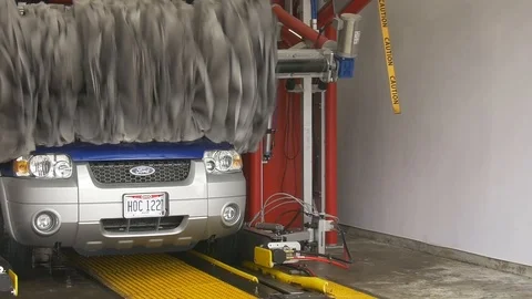 Blue Ford Escape Starting to Exit Car Wash Stock-Footage 102401393