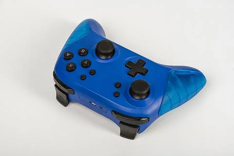 Blue game controller for playstation on a white background. Stock Photos