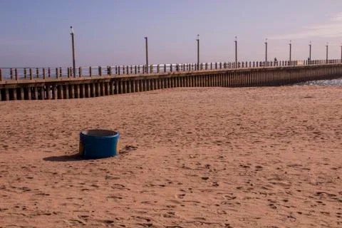 Blue Garbage Bin on Sand Stock Photos