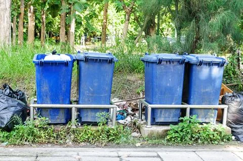 Blue garbage cans Stock Photos