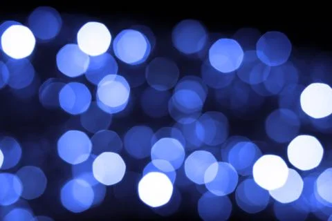 Blue garland out of focus. Festive background. Circles of light. Merry Christ Stock Photos