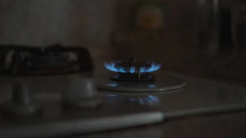 Blue Gas Flame Burning on Kitchen Stove Burner in Dark Room Stock-Footage 348604250