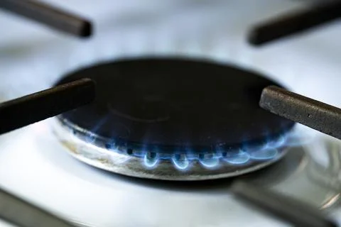 Blue Gas Flame Burning on Kitchen Stove Burner Close Up Stock Photos