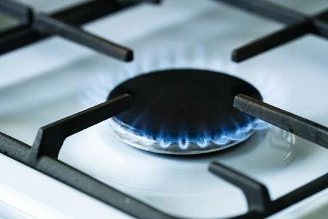 Blue Gas Flame Burning on Kitchen Stove Burner Close Up Фото