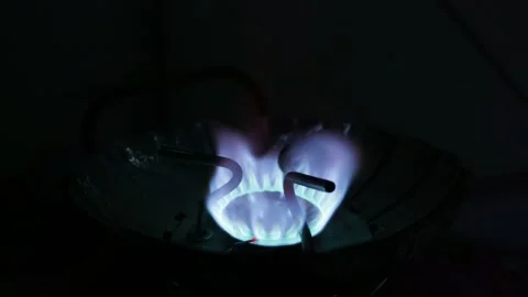 Blue Gas Flame Burning on Portable Camping Stove in Complete Darkness Stock Footage 341994944
