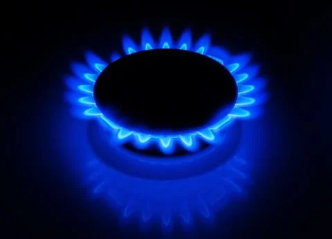 Blue gas stove in the dark Stock Photos
