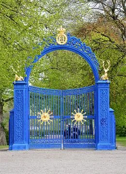 Blue gate in the park Stock Photos