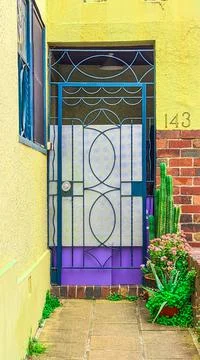 Blue Gate on Yellow Wall Stock Photos