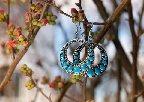 Blue gemstone earrings Stock Photos