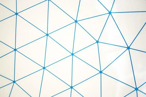Blue Geometric Network Of Triangles On White Wall 스톡 사진