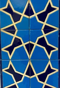 Blue geometric tile pattern with interlocking shapes Stock Photos
