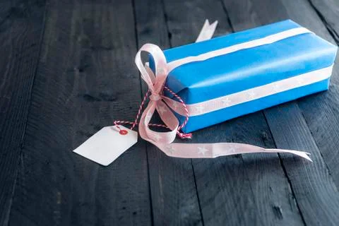 Blue gift with a blank label Stock Photos