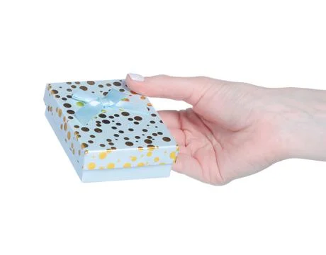 Blue gift box in hand Stock Photos