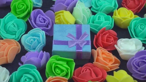 Blue gift in decorative florets Stock Footage 102881186