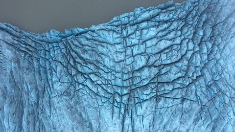 Blue Glacier Field with stunning textures meets the amazing water of Iceland Stock-Footage 128663003