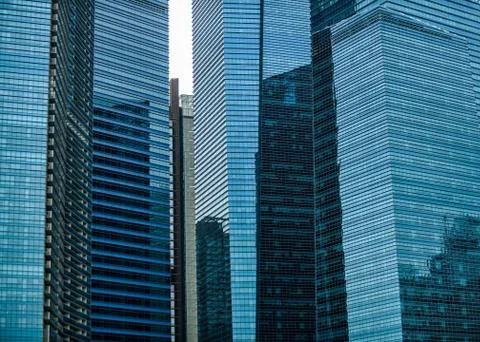 Blue glass skyscraper wall surface close up, financial city district Stock Photos