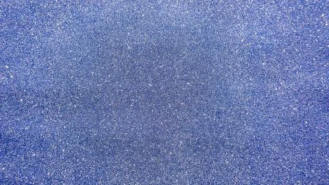 Blue glitter for an abstract background. Stock Photos