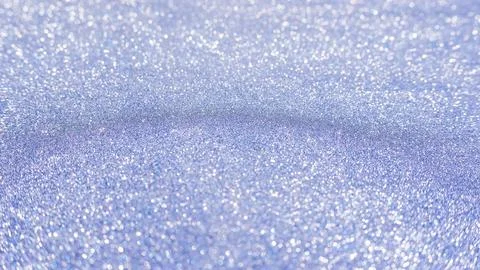 Blue glitter for an abstract background, selective focus. Stock Photos