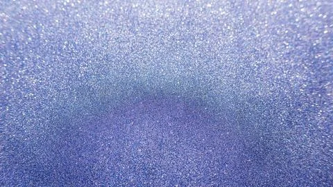 Blue glitter for an abstract background, selective focus. Stock Photos