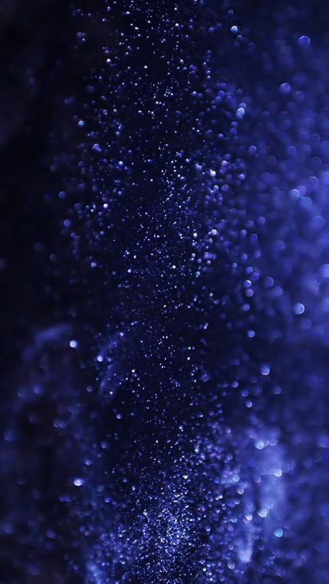 Blue glitter background in slow motion. Blue particles on black background Stock Footage 271378505