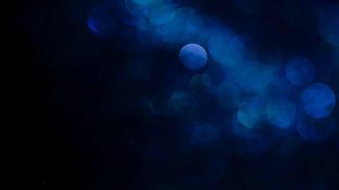 Blue glitter in blur on a black background. Stock Footage 108313870