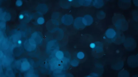 Blue glitter particles exploding in slow motion Stock Footage 293101730