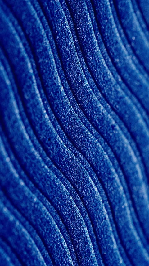 Blue glitter wavy texture slow pan. Video stock 337775861