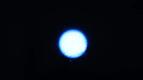 Blue glowing ball on a black background. | Stock Video | Pond5