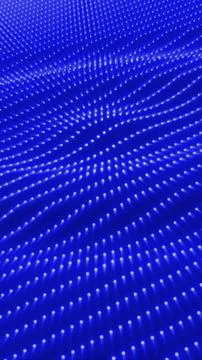 Blue glowing digital surface with an array of evenly spaced lights creating.. Stock Photos