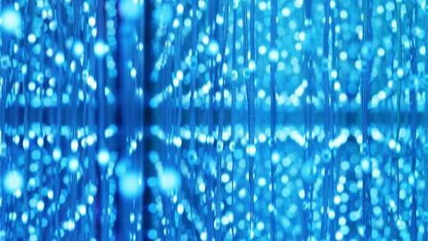 Blue glowing particles creating an abstract digital communication background Foto stock